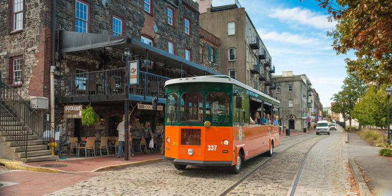 Savannah Old Town Trolley driving down River Street